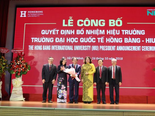 Associate Professor, Dr. Ho Thanh Phong receives flowers from the lecturers of HIU and other universities.
