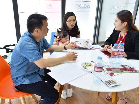 Parents exploring the school’s curriculum at the event