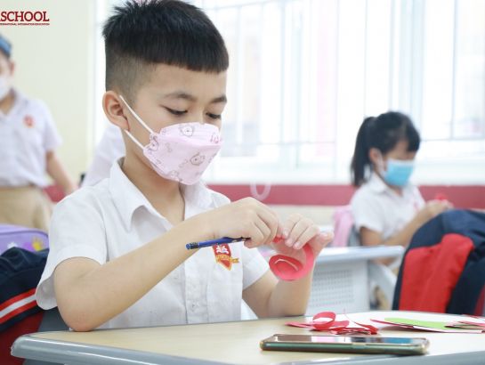 Students take great care to make cards for their mothers.