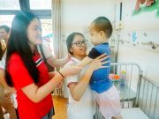SNA students taking care of children in Hoa Binh Village